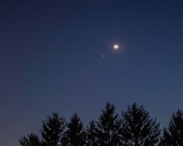 Triple Conjunction A triangle made up of the Moon, Jupiter, and Venus (top) appear to point at the Pleiades cluster. This is a 3.2-second exposure taken with a Canon 550D (T2i)...